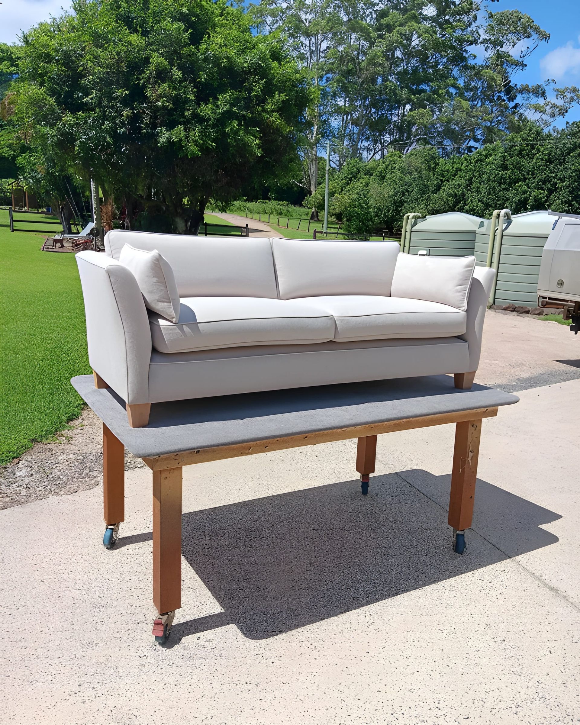A Beige Couch on a Wooden Table — Cupitt's Quality Upholstery in Ballina, NSW