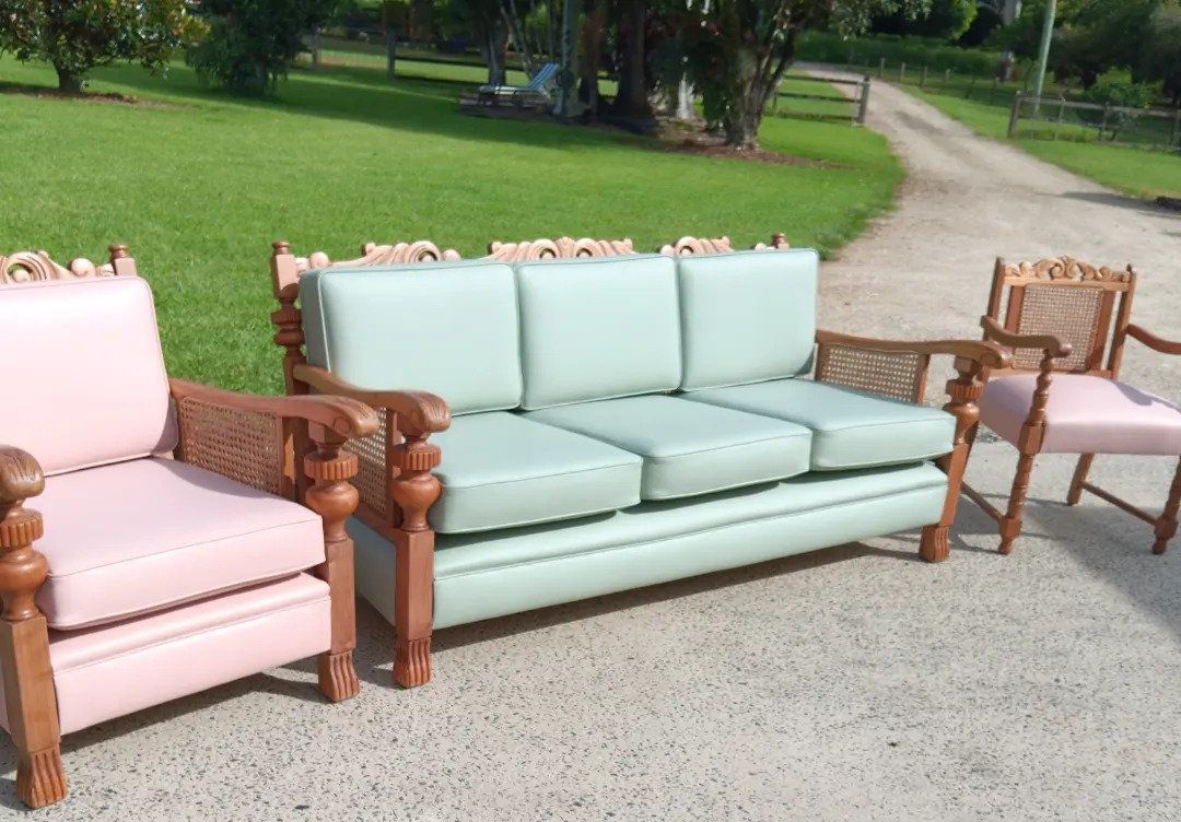Pink and mint green antique furniture set on a concrete surface outdoors — Cupitt's Quality Upholstery in Rous, NSW