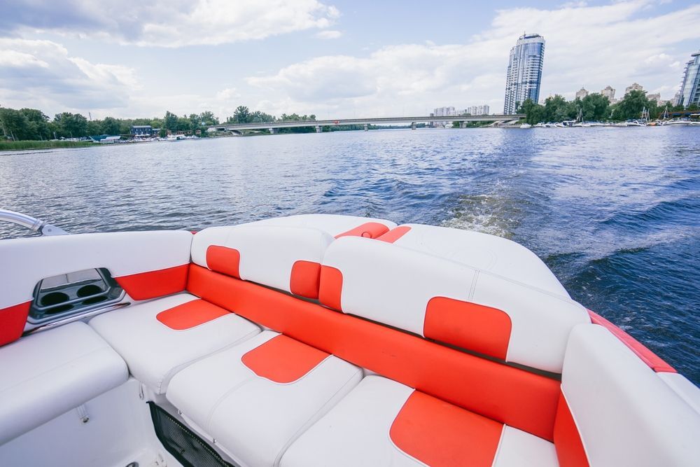 A Boat Interior With White and Red Seating — Cupitt's Quality Upholstery in Lismore, NSW