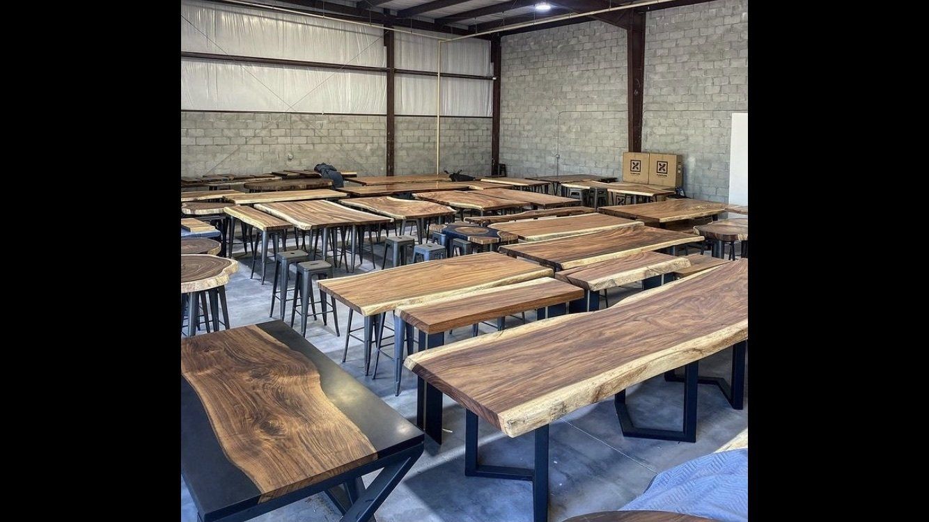 A large room filled with wooden tables and chairs.