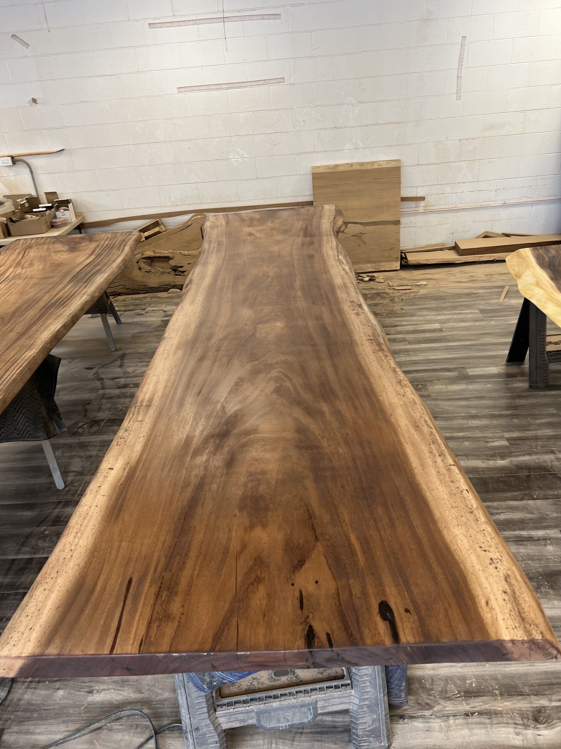 A wooden table is sitting on top of a wooden floor in a room.