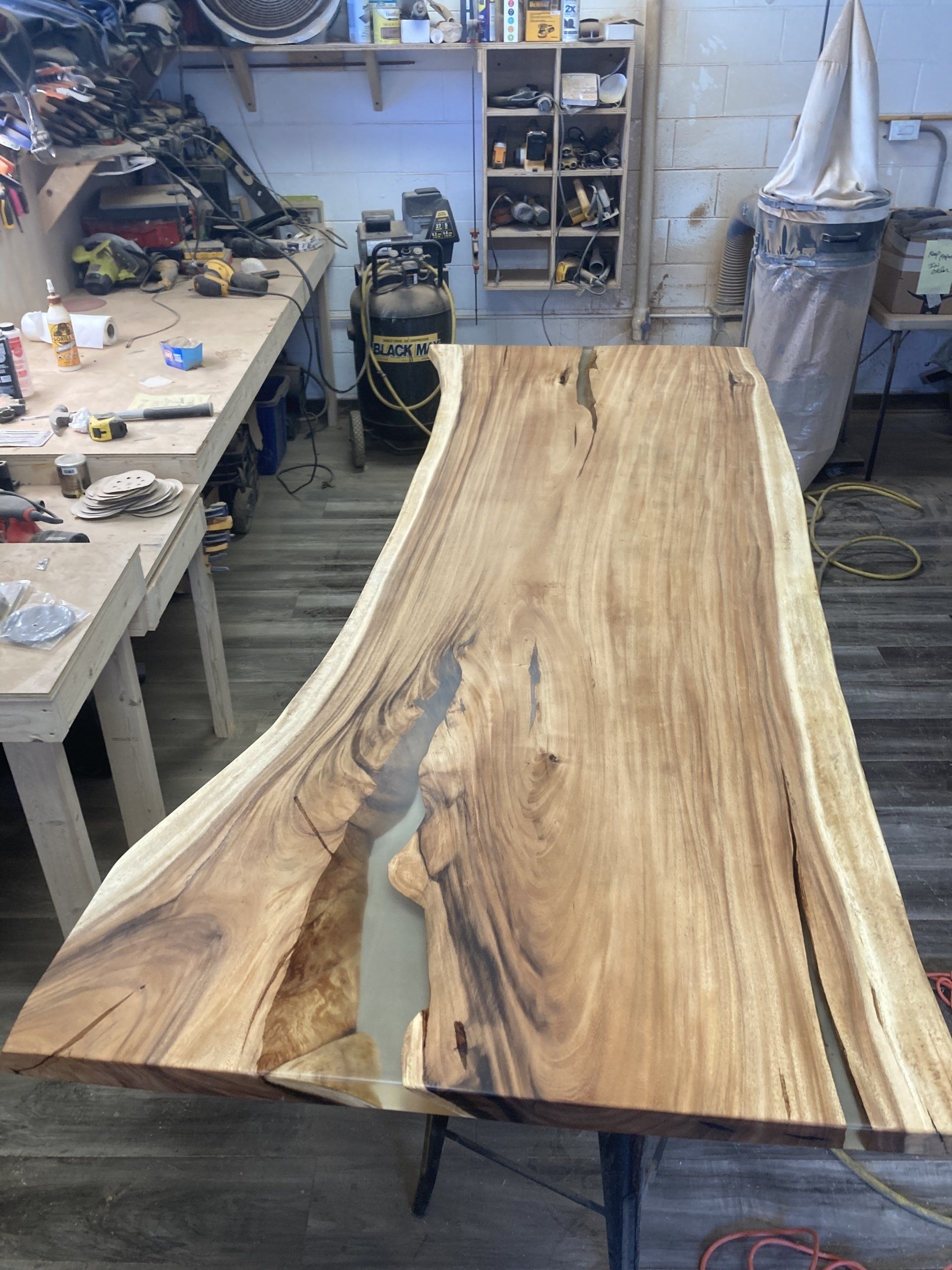 A wooden table is sitting on top of a wooden table in a workshop.