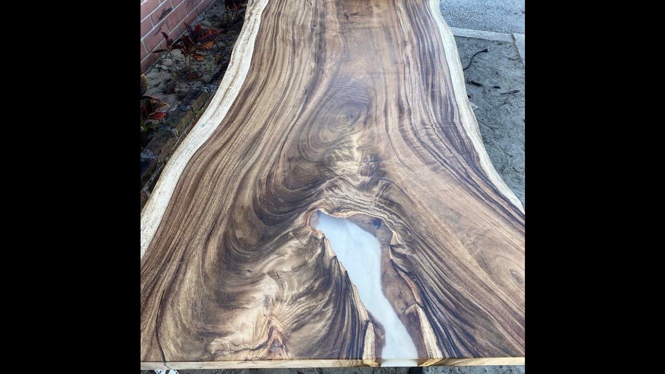 A piece of wood with a hole in the middle of it.