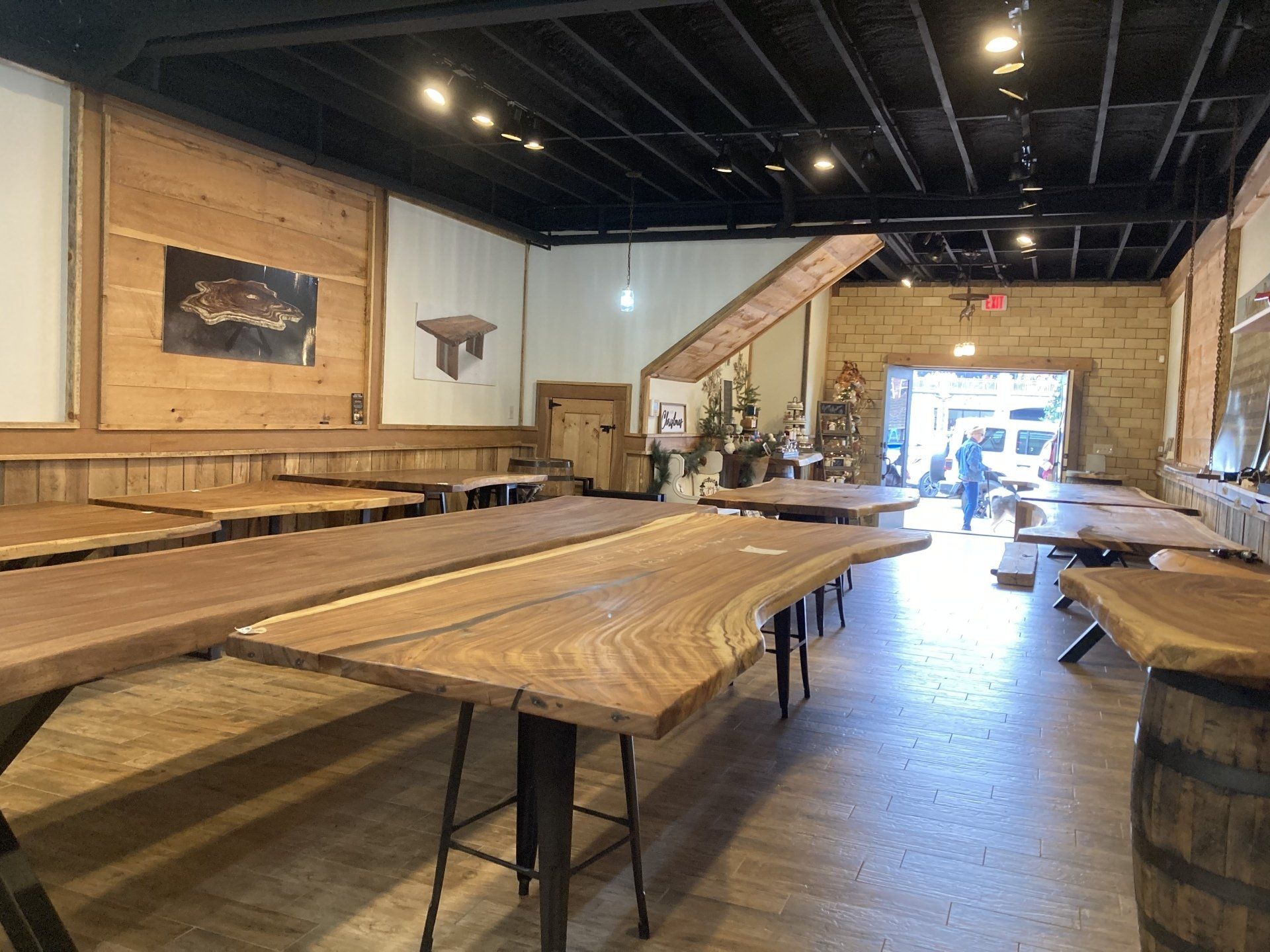A large room filled with wooden tables and benches.