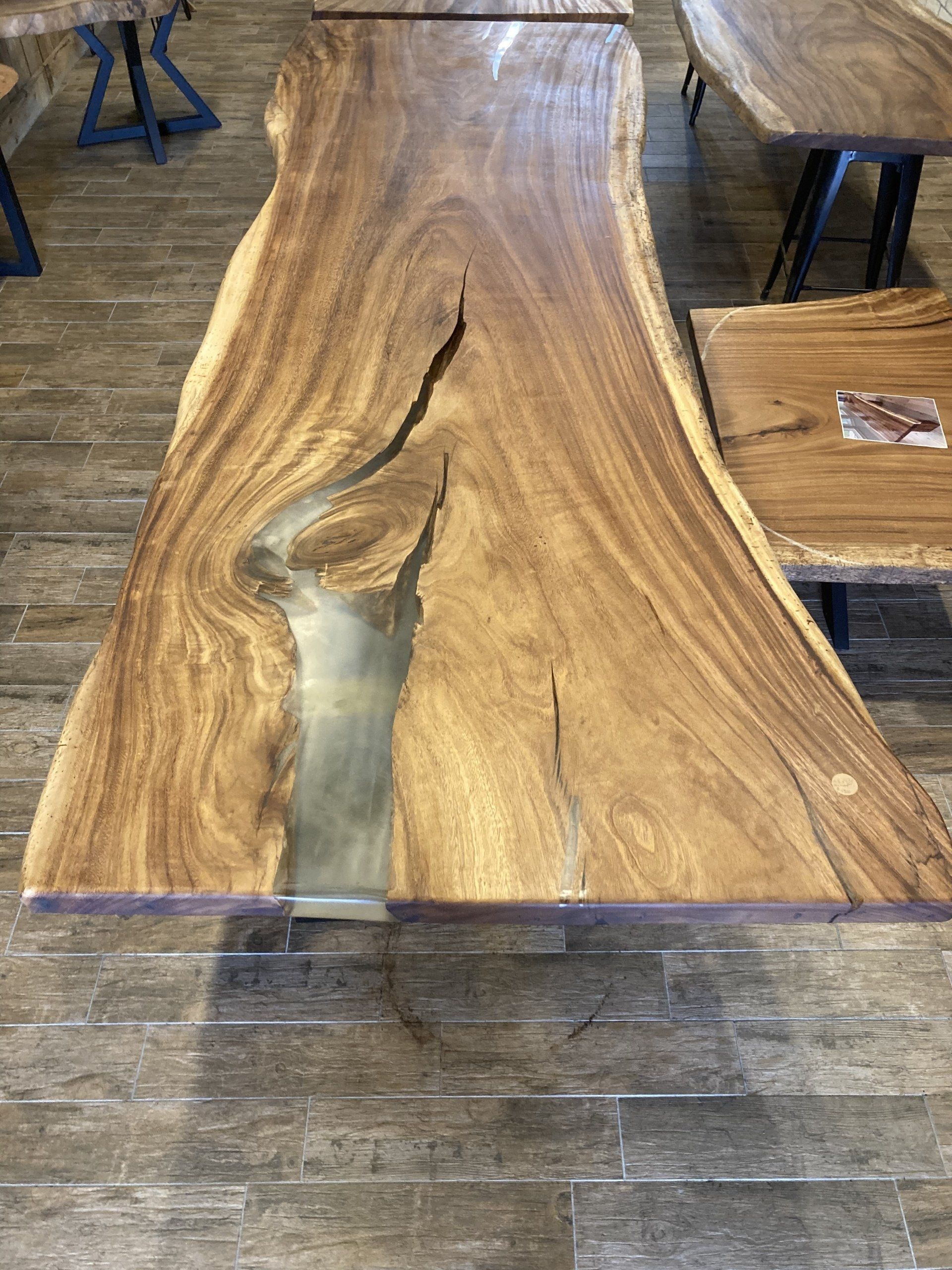 A wooden table with a river in the middle of it.