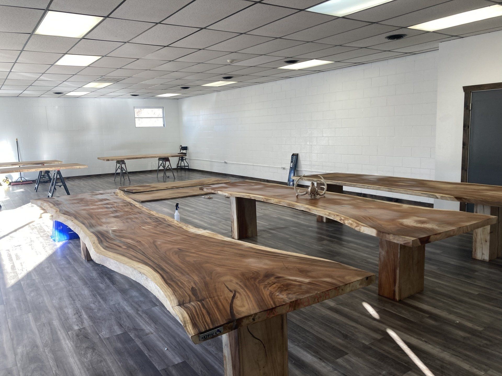 A room filled with wooden tables and benches.