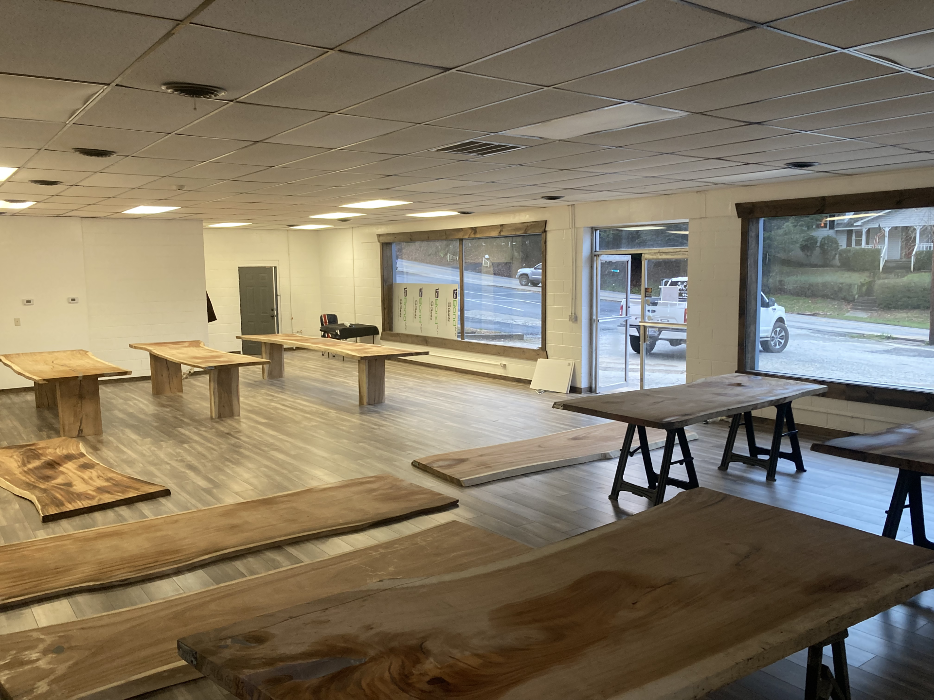 A large room filled with wooden tables and benches.