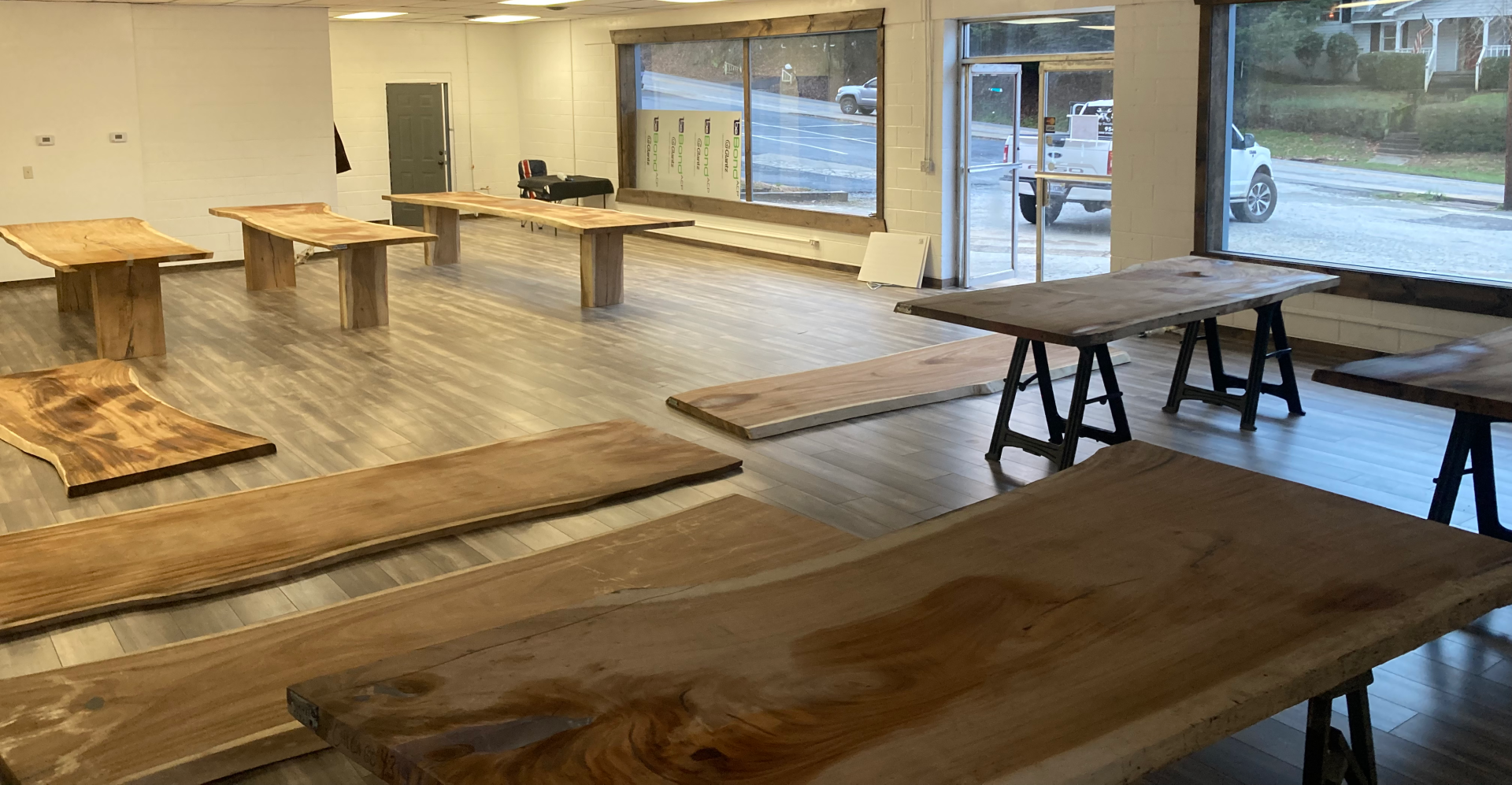 A large room filled with wooden tables and benches.