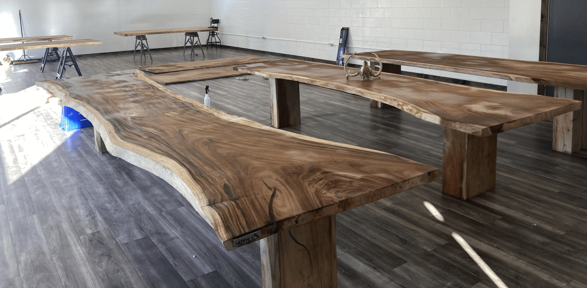 A room filled with wooden tables and benches.