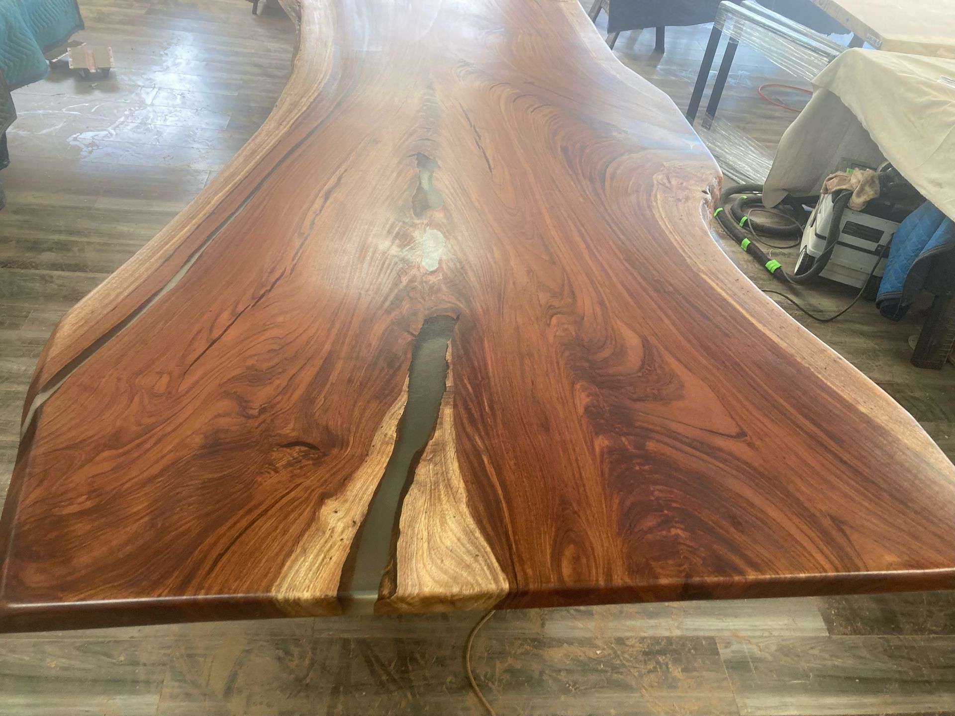 A wooden table with a hole in the middle of it