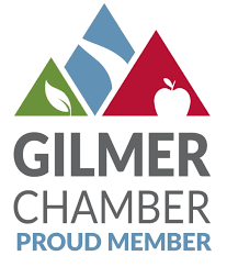 A logo for the gilmer chamber proud member