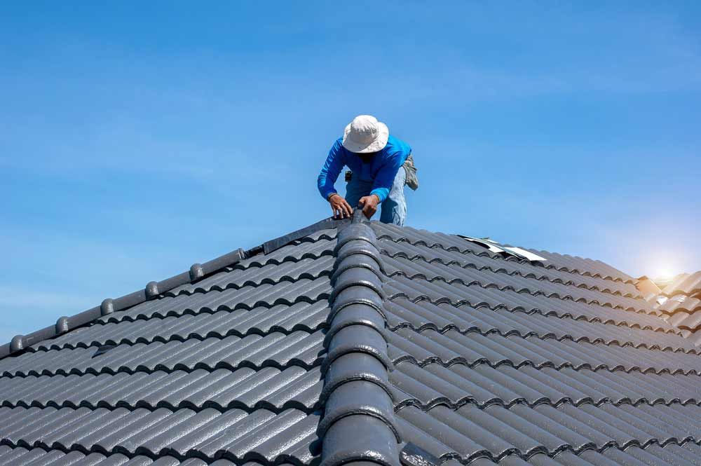 Construction Roofer Installing Roof Tiles — Roof Force Australia in Gold Coast, QLD