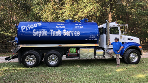 A blue septic tank with white text, next to a smiling man, on a forest. A blue septic tank with white text, next to a smiling man, on a forest.