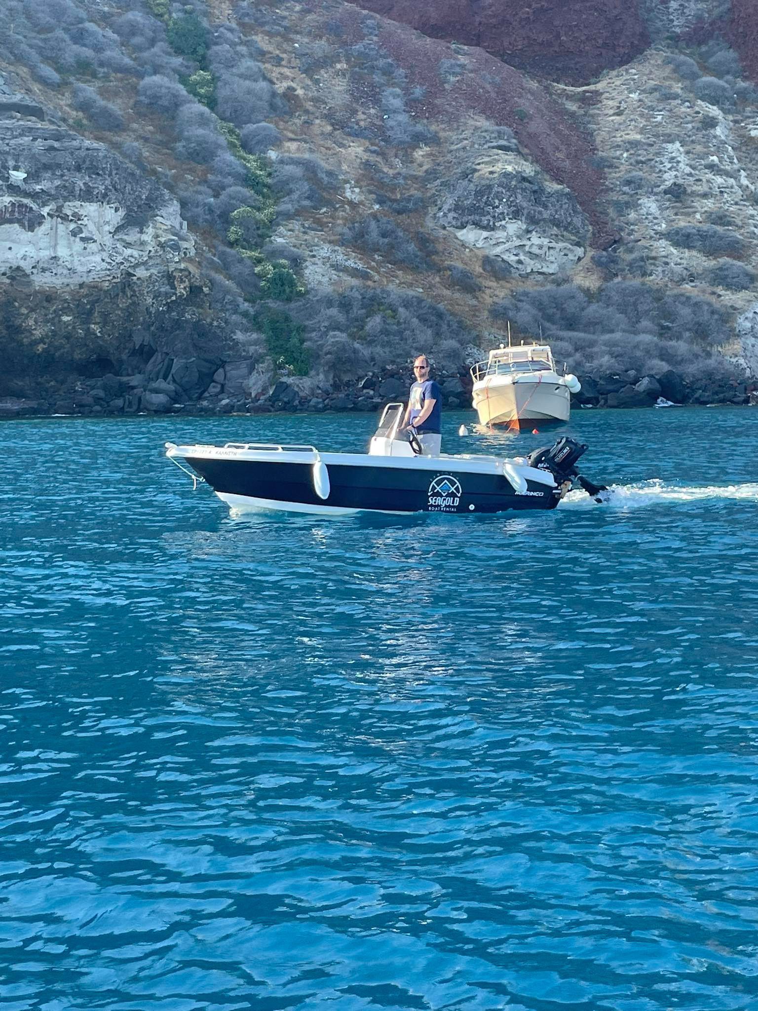 Our Capt. Alex cruising around Santorini