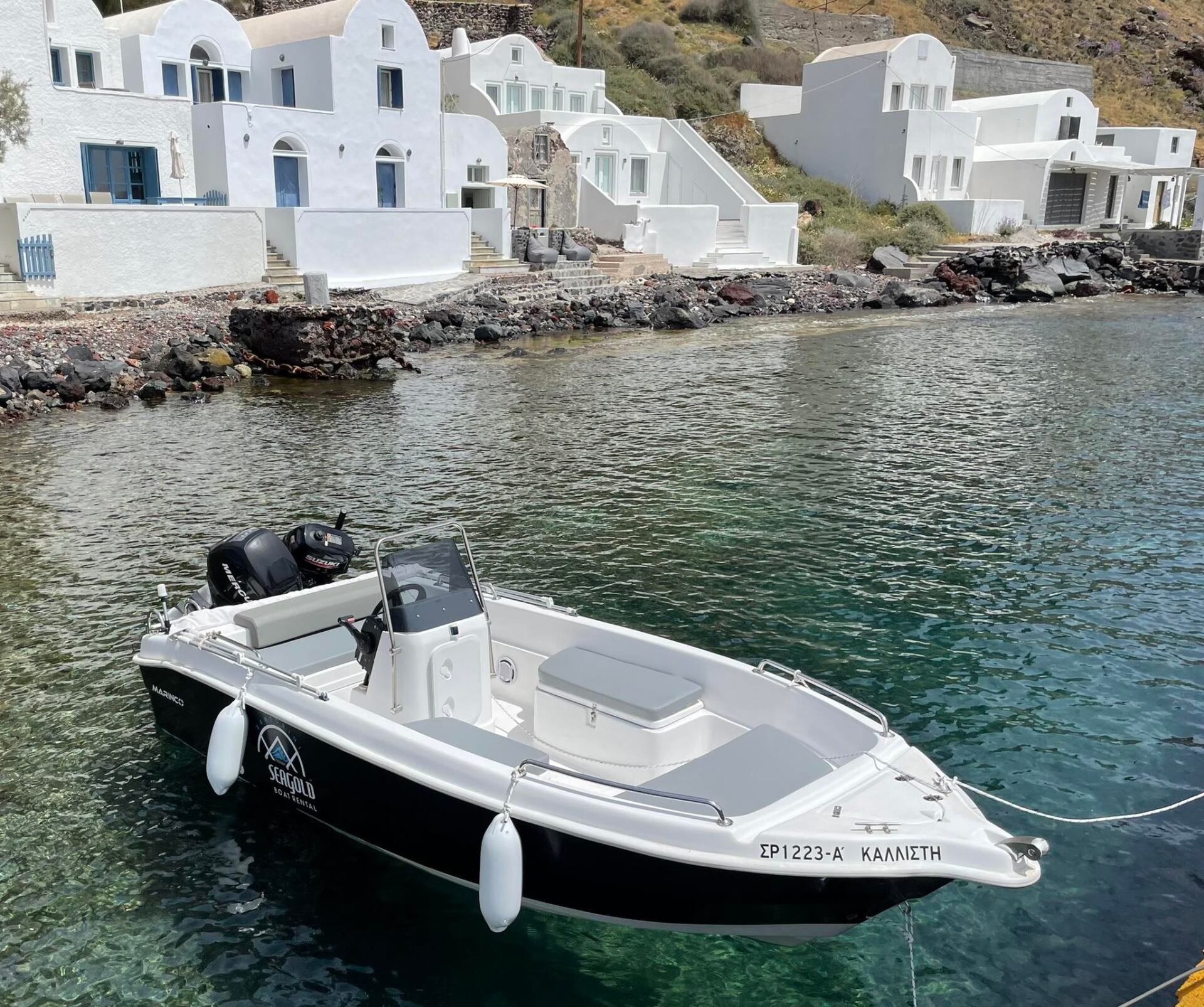 A Rental Boat At Ammoudi Beach in Santorini