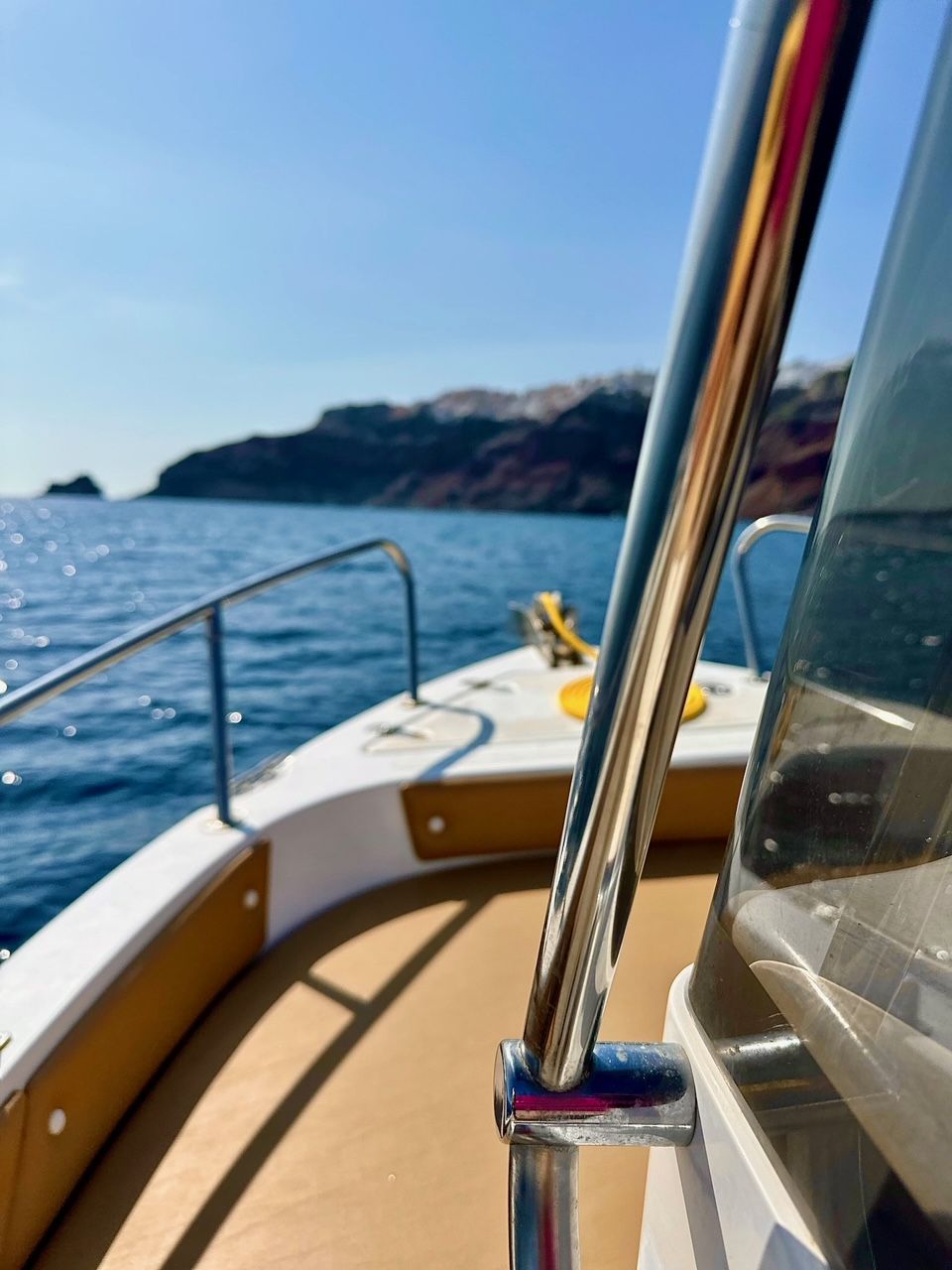 A boat cruising around Santorini