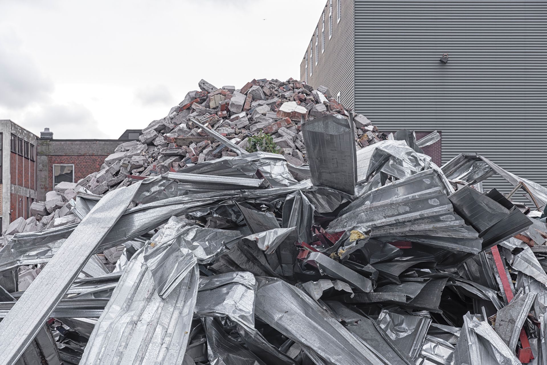 Pile of metal and rubble debris in industrial area. Pile of metal and rubble debris in industrial area.