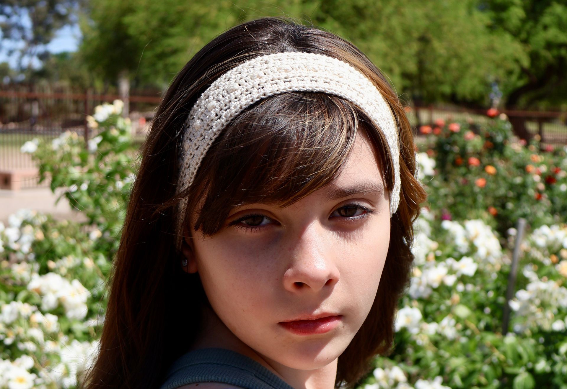Hand-crocheted cotton headband featuring bead stitch and filet stitch patterns.
