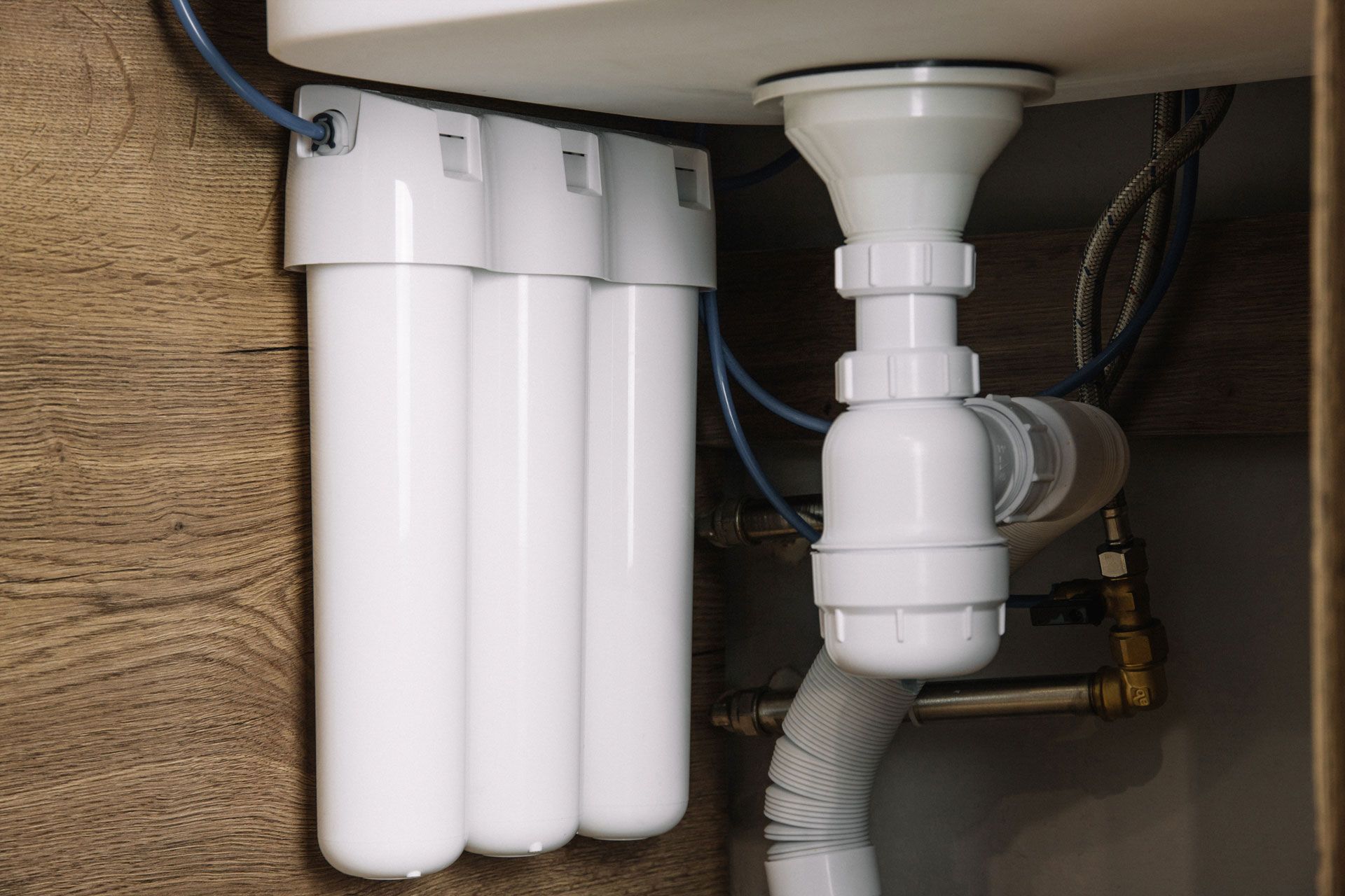 A sink with a water filter attached to it.