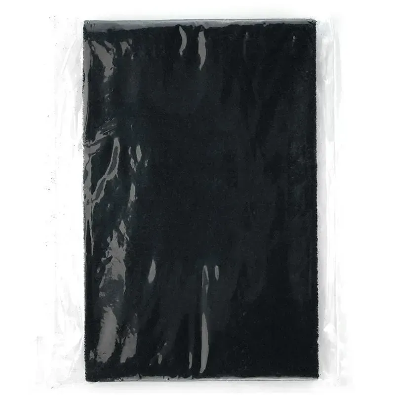A black piece of paper is in a plastic bag.