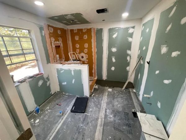 A room with a lot of walls and a window.