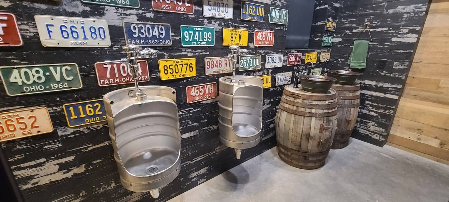 A wall with a lot of license plates on it