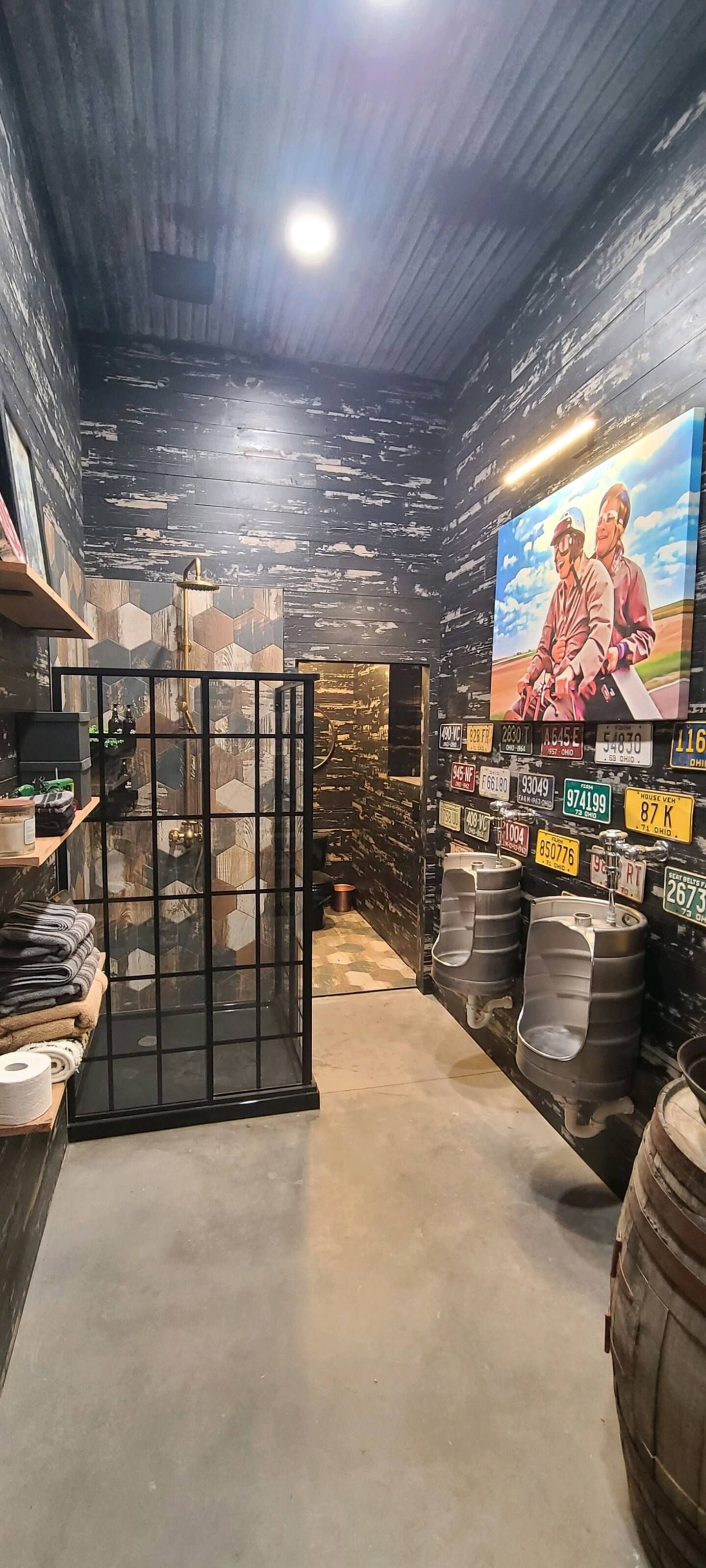 A room with a fence and a painting on the wall.