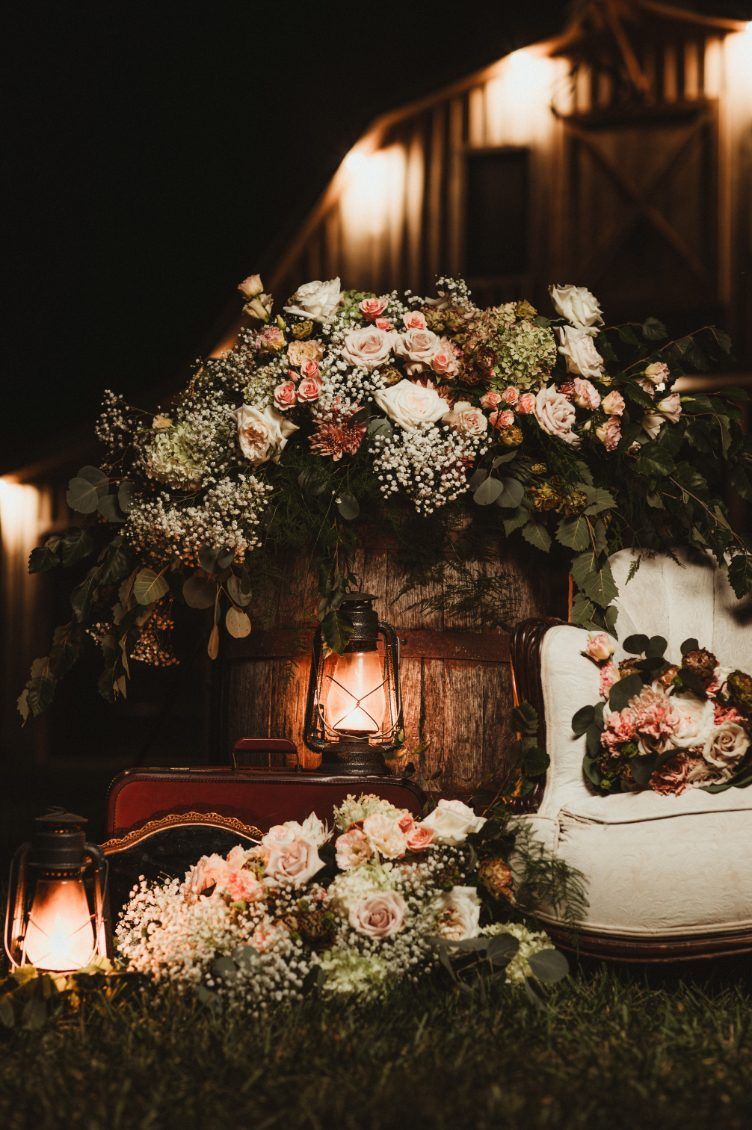 A small house in the middle of a forest with a fireplace.
