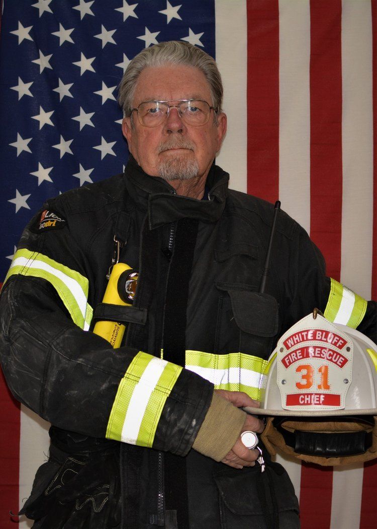 A fireman with the number 31 on his helmet