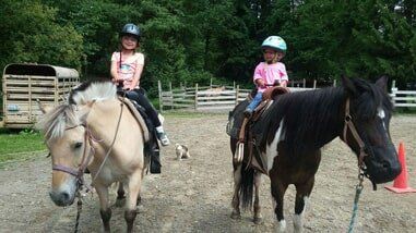 Two young girls on horses - Horse riding lessons in Olalla WA