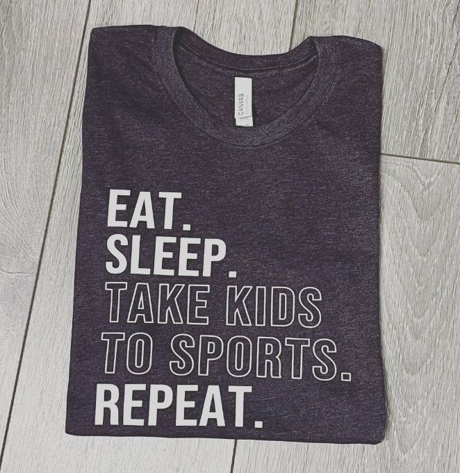 A t-shirt that says eat sleep take kids to sports repeat