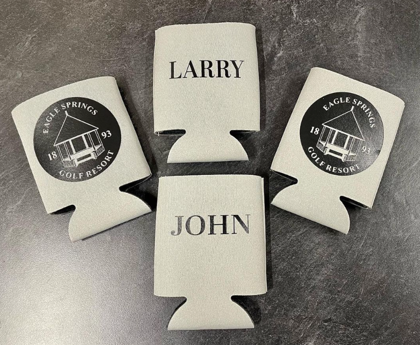 Four can holders with the names larry and john on them