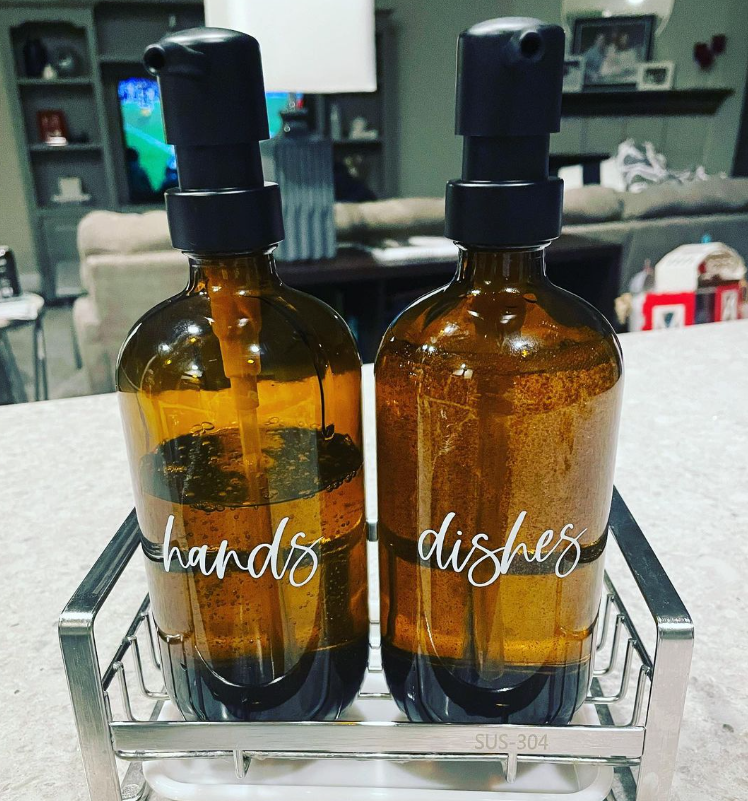 Two bottles with the words hands and dishes on them