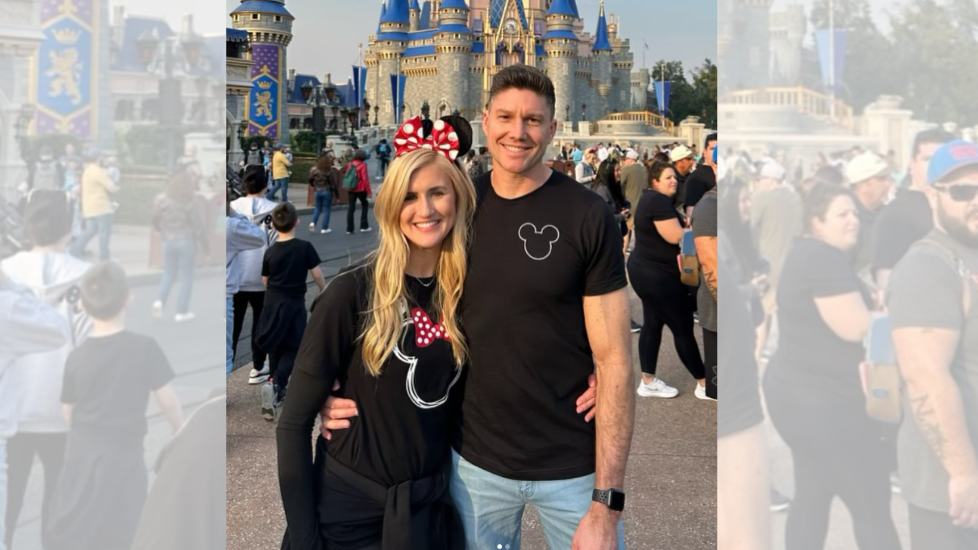 A man and a woman are posing for a picture in front of a castle.