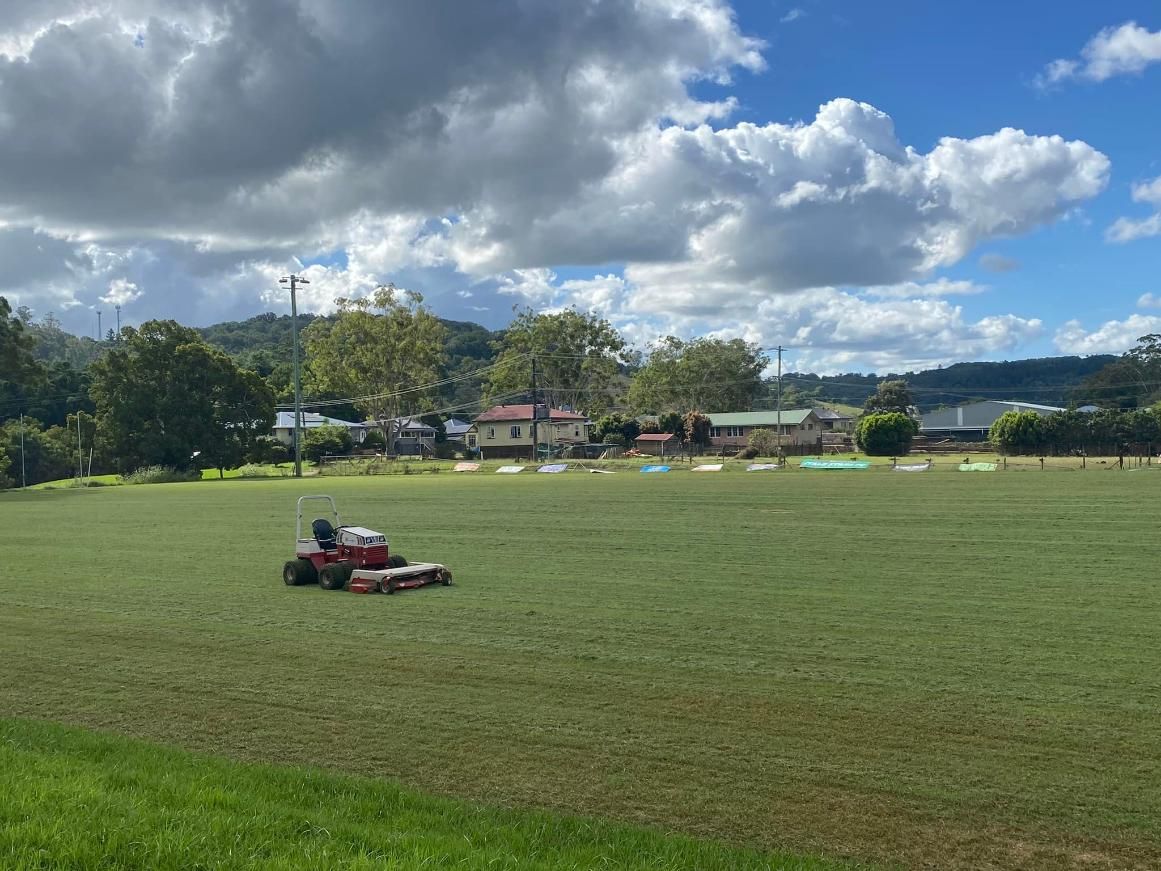 A Lawn Mower is Cutting Grass in a Large Field — 4WD Slashing & Large Area Mowing In Evans Head, NSW