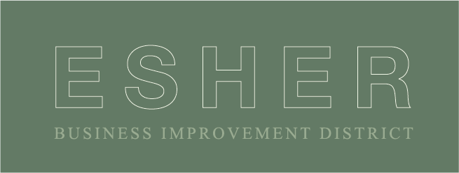 The logo for the esher business improvement district is green and white.