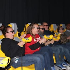 A group of people are sitting on a roller coaster.