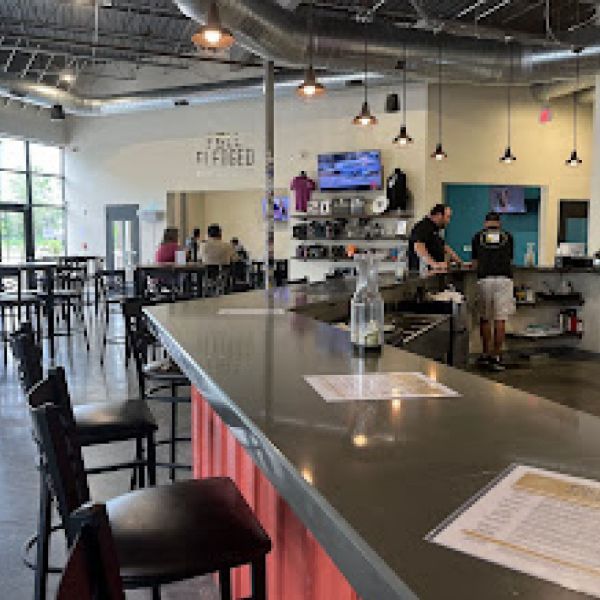 A bar in a restaurant with a menu on it