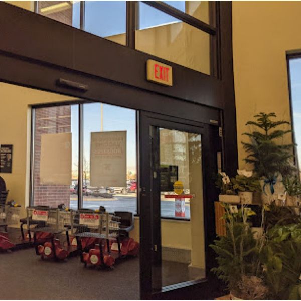 A store with a red exit sign above the door