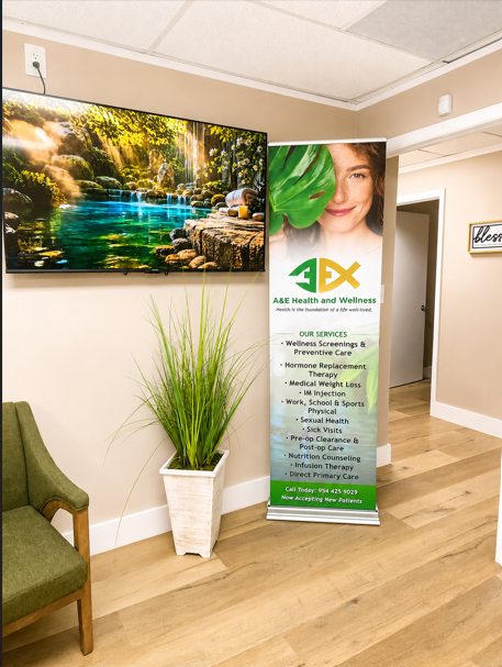 Office lobby with framed waterfall art, potted plant, and a standing 3EX promotional banner.