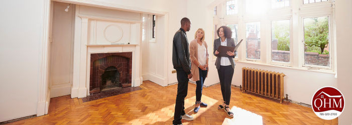 A property manager showing a home to a couple.