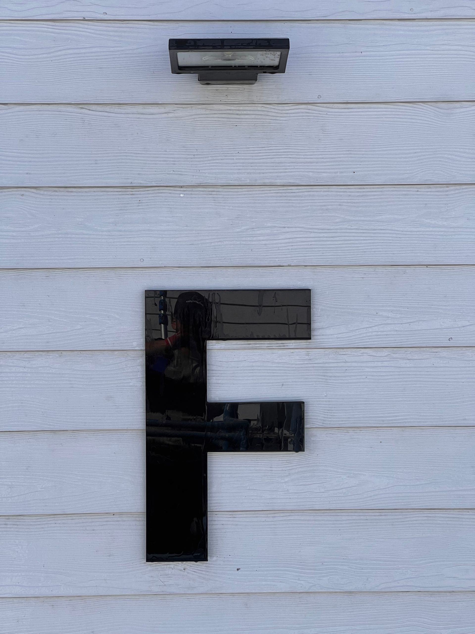 Close-up of a large, black letter