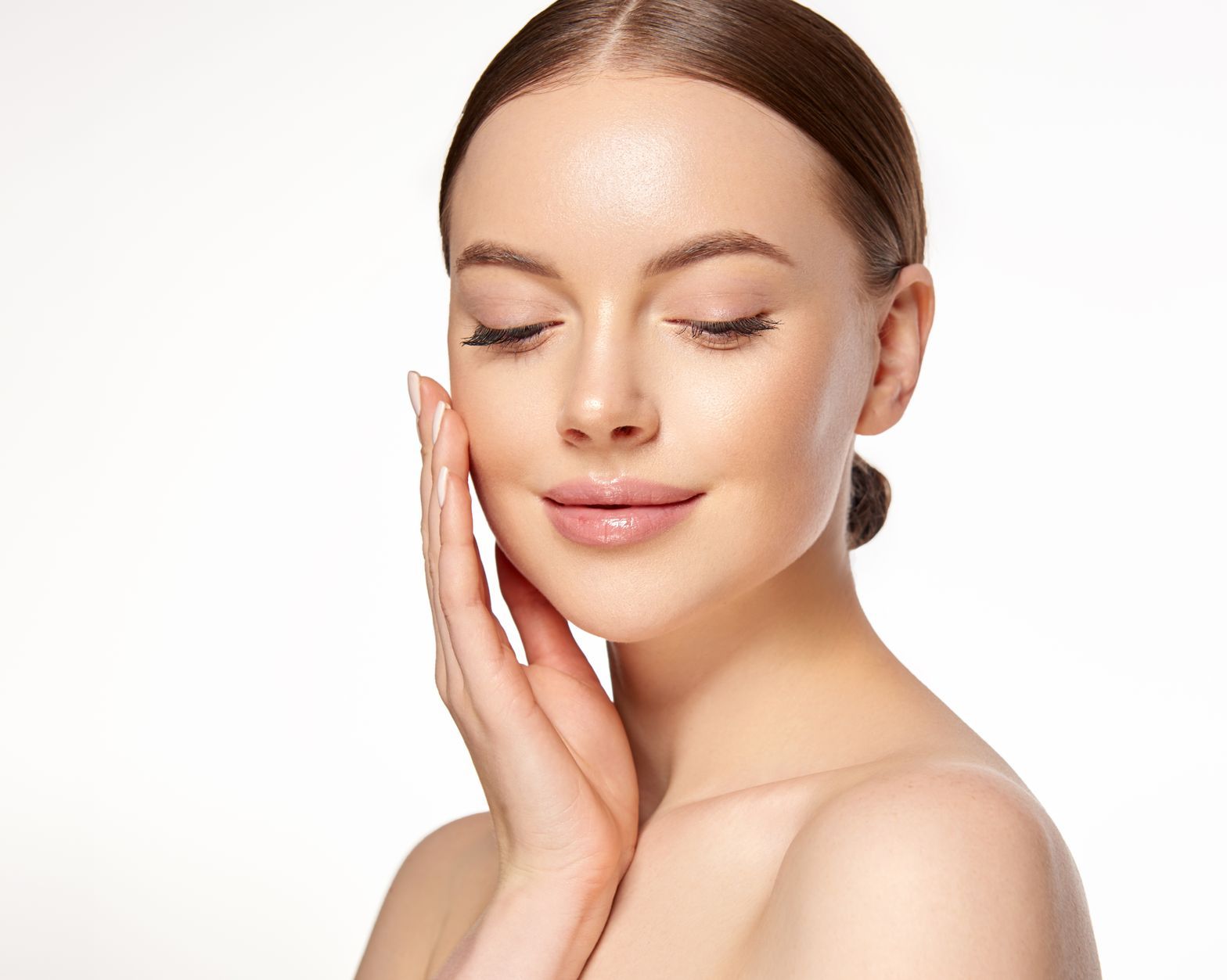 A woman is getting a botox injection in her face.