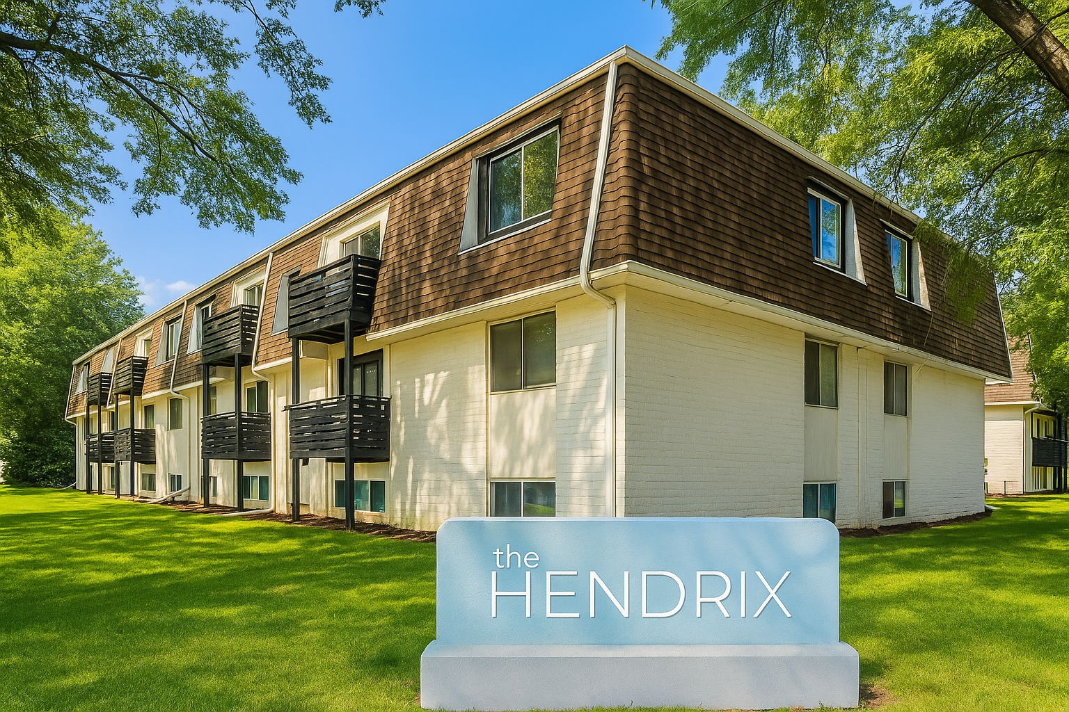 A white apartment building with a sign that says hendrix in front of it.