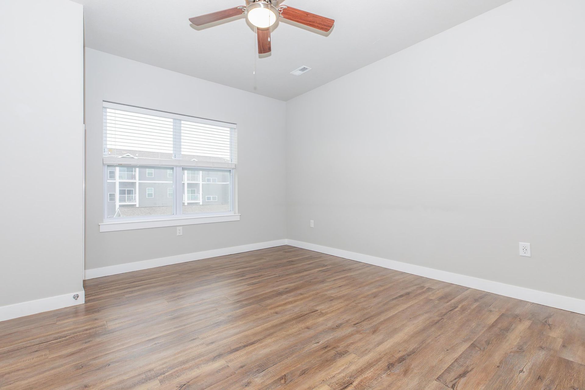 Living room photo of The Grove on Devils Glen apartments in Bettendorf, IA
