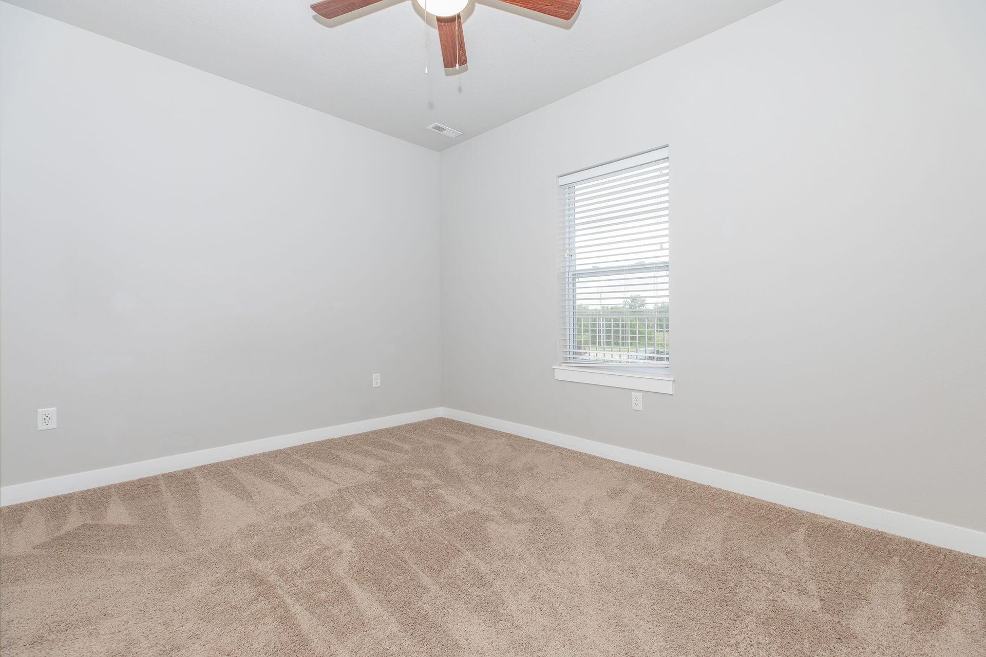 Bedroom photo of The Grove on Devils Glen apartments in Bettendorf, IA