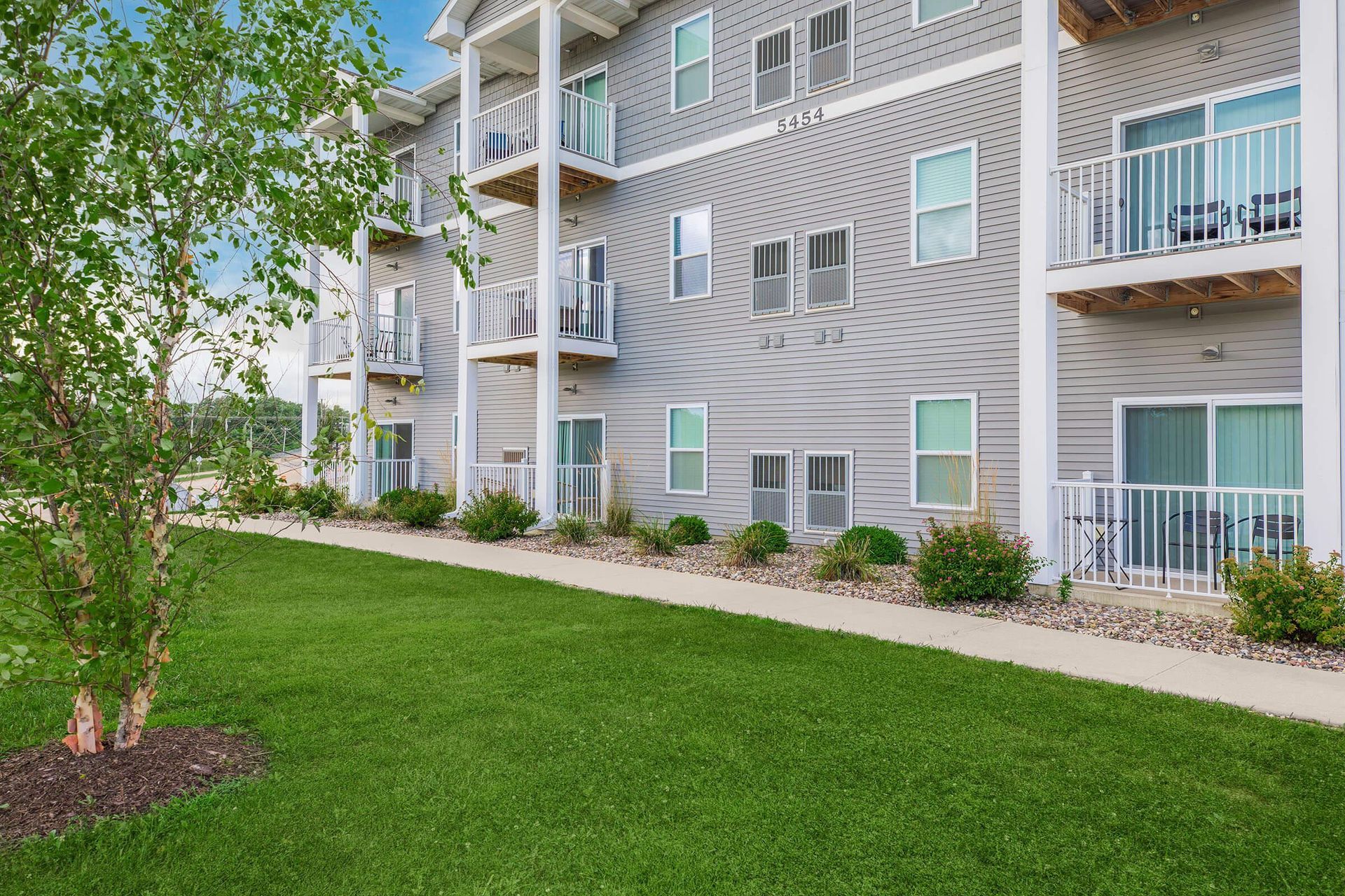 Exterior photo of The Grove on Devils Glen apartments in Bettendorf, IA