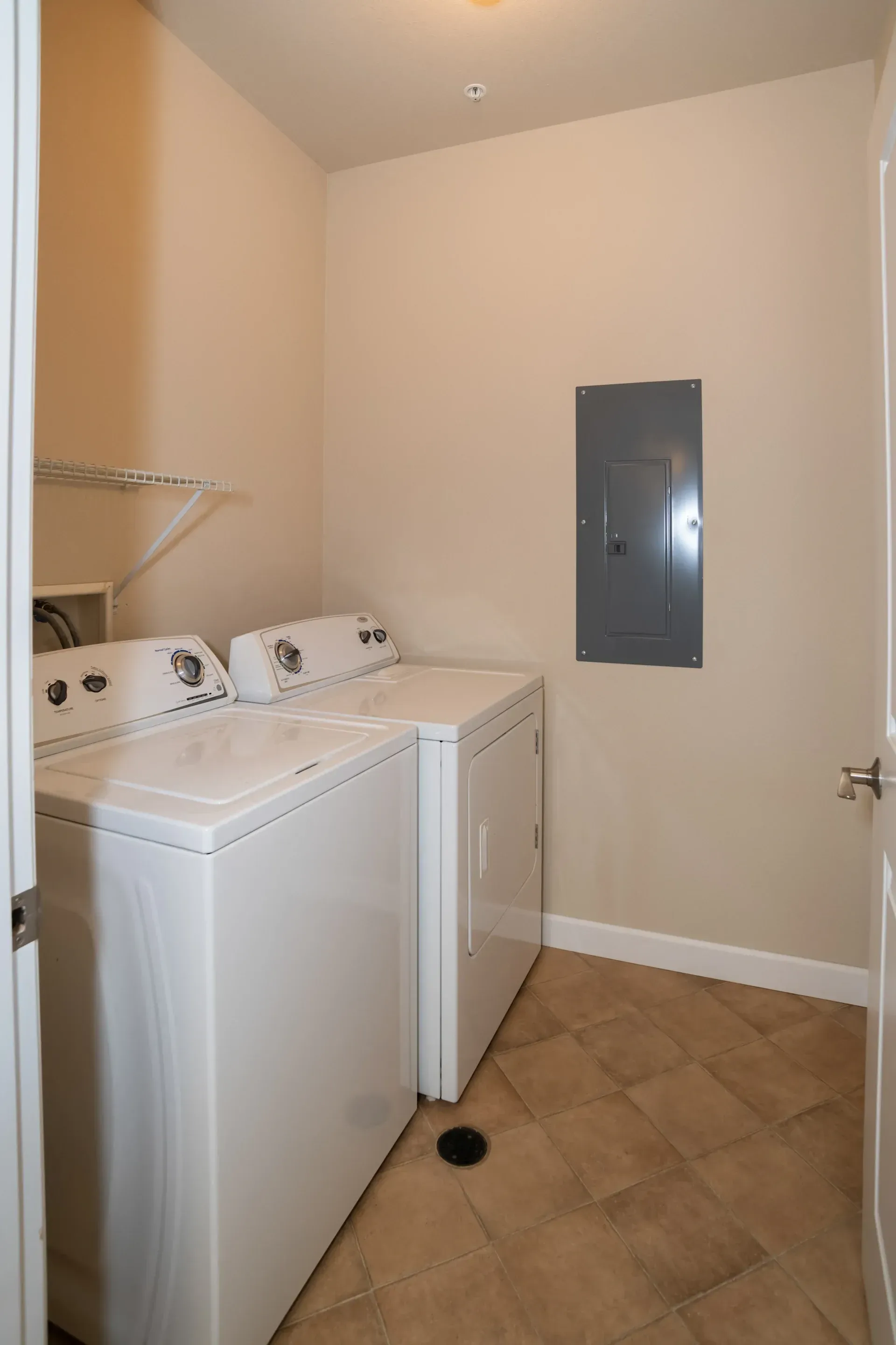 A laundry room with a washer and dryer in it