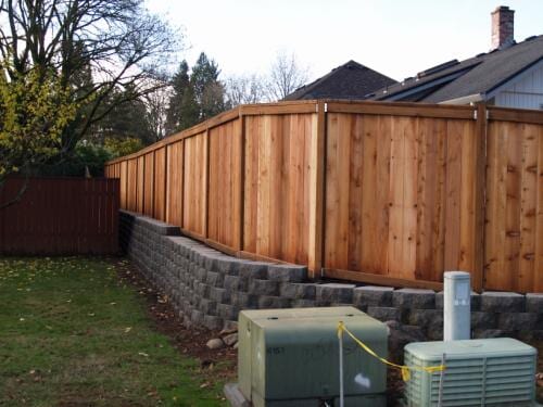 Fence on top of retaining wall
