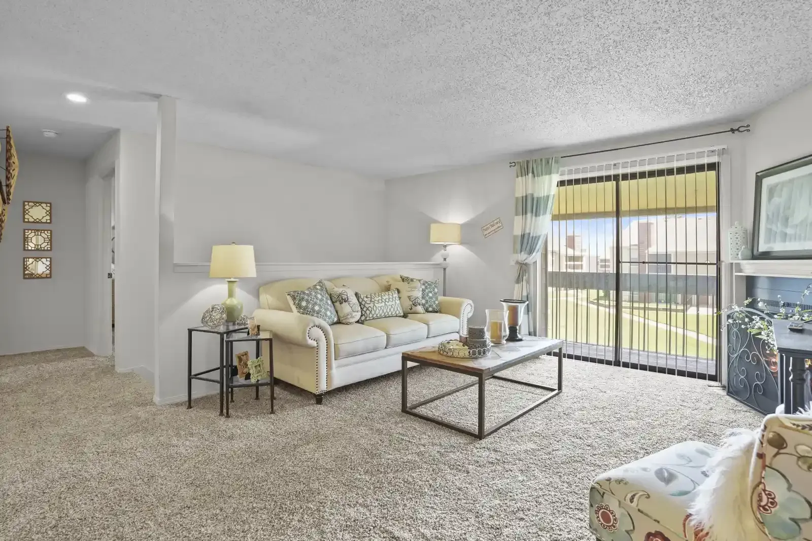 Cozy living room featuring a beige sofa and decorative table.